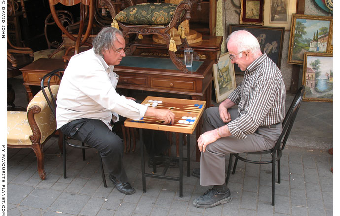Athenian stall holders playing tavli (backgammon) at the Flea Market, Monastiraki, Athens at The Cheshire Cat Blog