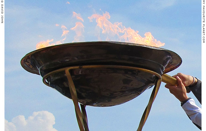 The Olympic flame burns in Thessaloniki, Macedonia, Greece at The Cheshire Cat Blog