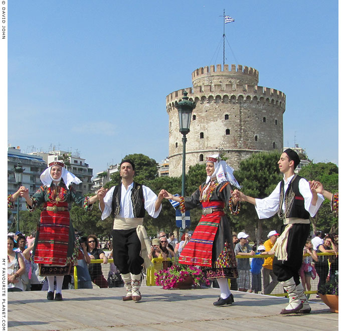 Young Macedonians dancing in traditional Greek costumes in Thessaloniki, Greece, at The Cheshire Cat Blog