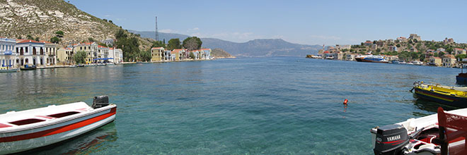 Panoramic of Kastellorizo harbour, Greece, with the Turkish mainland beyond at My Favourite Planet