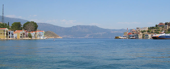 Panoramic of Kastellorizo harbour and the Lycian coast of Turkey beyond at My Favourite Planet