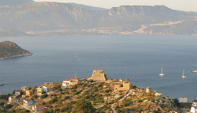 View of the Kavos headland and Knights' Castle from the clifftop above Kastellorizo, Greece at My Favourite Planet