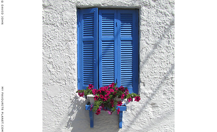 Blue window shutters in Olympiada, Halkidiki, Macedonia, Greece at My Favourite Planet
