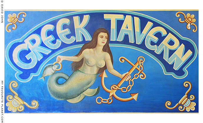 Greek taverna sign with mermaid in Olympiada village, Halkidiki, Macedonia, Greece at My Favourite Planet