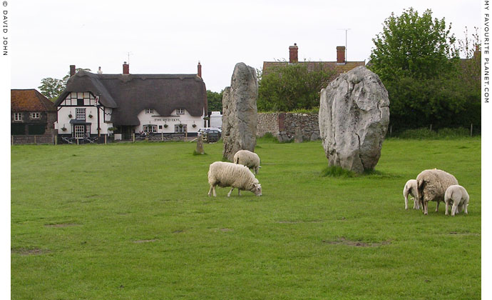 Avebury village. Megaliths of Avebury Henge, with The Red Lion pub in background at My Favourite Planet
