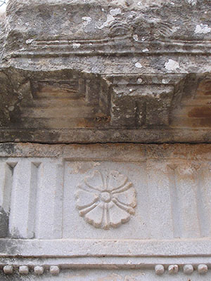 Metope with a floral relief behind behind the orchestra of the Great Theatre of Ephesus at My Favourite Planet