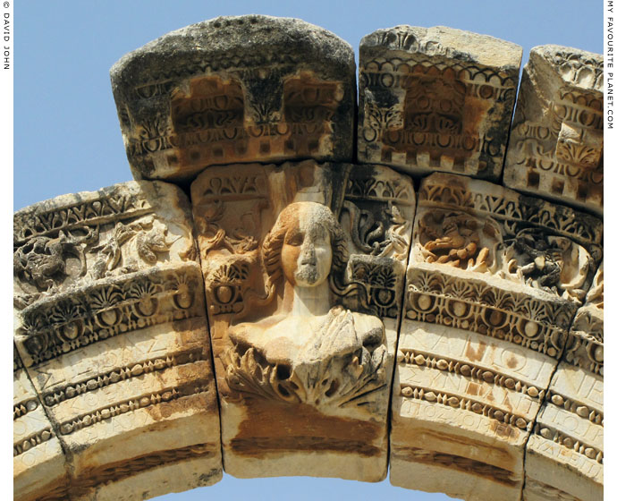 A bust of the goddess Tyche on the entrance archway of the Temple of Hadrian, Ephesus at My Favourite Planet