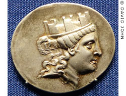 Coin from Smyrna showing the goddess Tyche wearing a mural crown