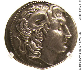 A silver tetradrachm coin depicting Alexander the Great wearing the ram's horns of Zeus Ammon at My Favourite Planet