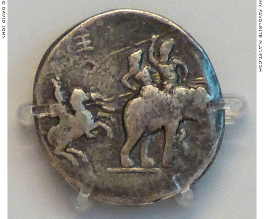 Silver decadrachm coin showing Alexander the Great fighting king Poros of Paurava on an elephant at My Favourite Planet