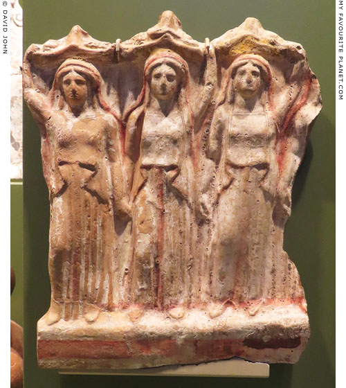 A terracotta pinax depicting three women carrying baskets of offerings for Persephone at My Favourite Planet