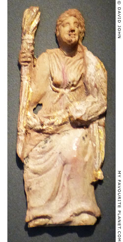 Gilt bone relief of Demeter, Persephone or Hekate holding a torch at My Favourite Planet