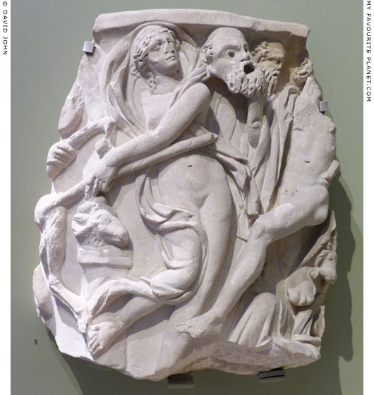 A marble relief of a dancing Maenad and a Satyr holding a mask of Silenus at My Favourite Planet
