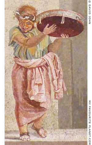 A street musician playing a tympanon in a mosaic by Dioskourides of Samos at My Favourite Planet