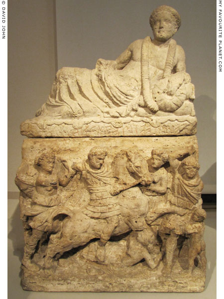 A relief interpreted as the myth of Athamas on a Etruscan cinerary urn at My Favourite Planet