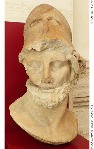 Marble head of a Greek strategos wearing a Corinthian helmet at My Favourite Planet