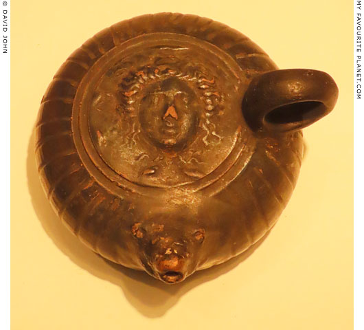 A Gorgoneion on a ceramic oil lamp at My Favourite Planet