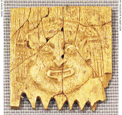 Relief of a Gorgoneion on the one handle of a comb at My Favourite Planet Relief of a Gorgoneion on the one handle of a comb at My Favourite Planet