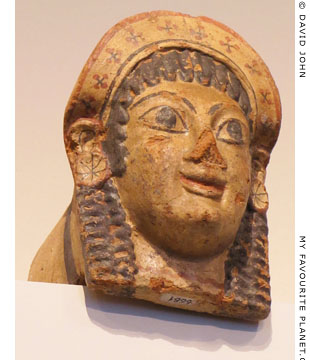 An Etruscan antefix in the form of a woman's head at My Favourite Planet