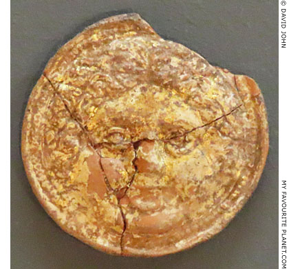 A gilded terracotta disc with a Gorgon head from Thesprotia, Epirus, Greece at My Favourite Planet