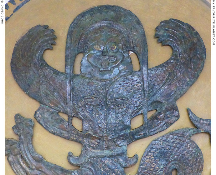 Detail of the winged Gorgon on the shield device in Olympia Archaeological Museum at My Favourite Planet