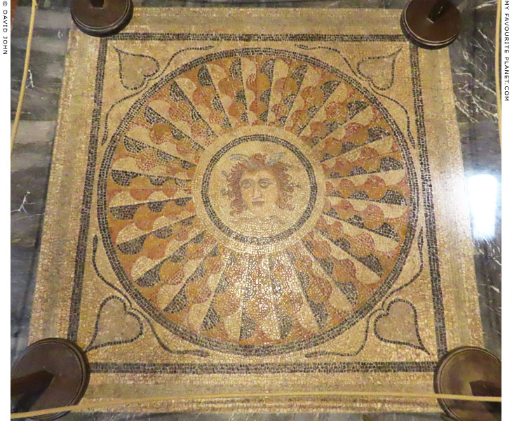 A winged Gorgoneion in the centre of a polychrome mosaic from Kos at My Favourite Planet