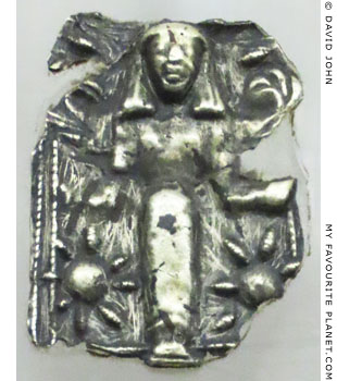 A silver plaque with a relief of a winged goddess holding rosettes at My Favourite Planet
